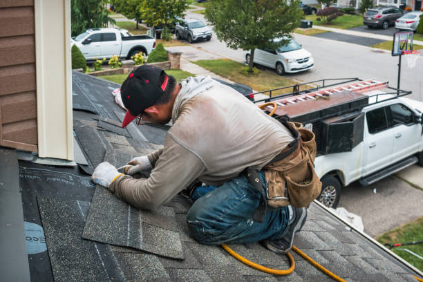 Professional Roofing technician working in Hydes, MD